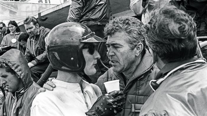 Ken Miles (left) confers with Carroll Shelby during the 1966 race. (Bernard Cahier/Getty Images)